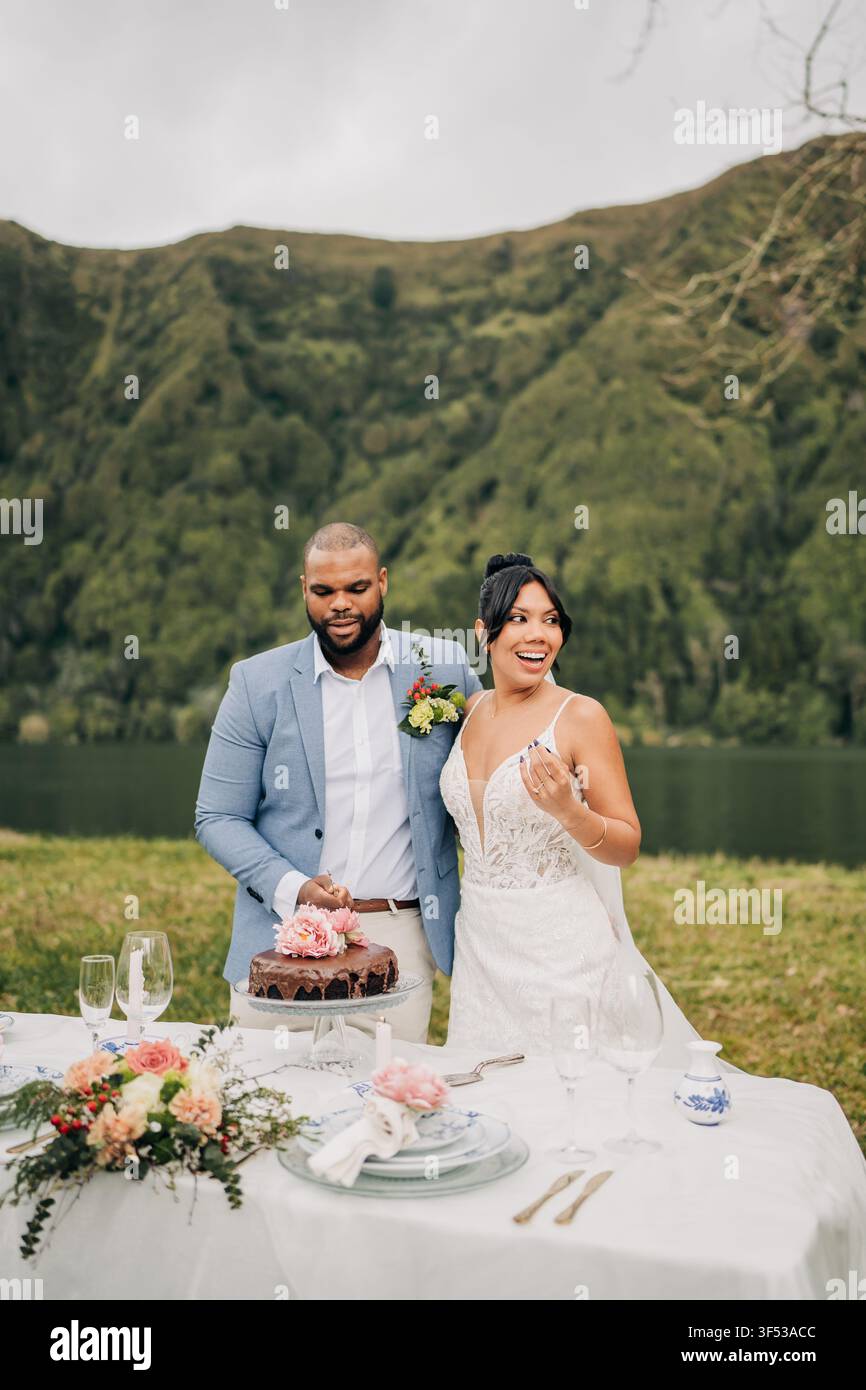 Happy couple celebrating their elopement outdoors Stock Photo