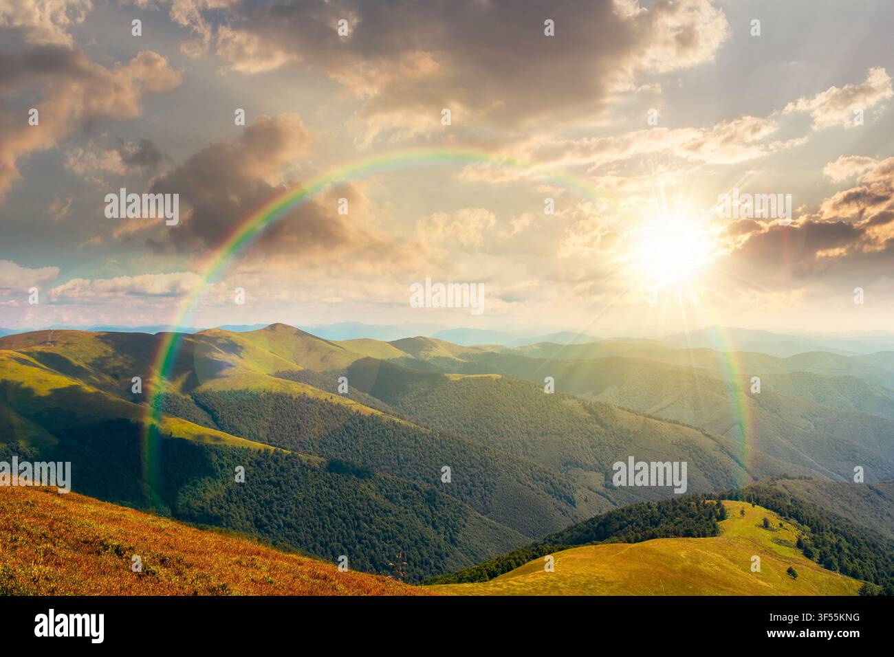 sunset over beautiful mountain landscape in summer. travel ukraine background. rolling hill in dappled light. scenic view of borzhava ridge. carpathia Stock Photo