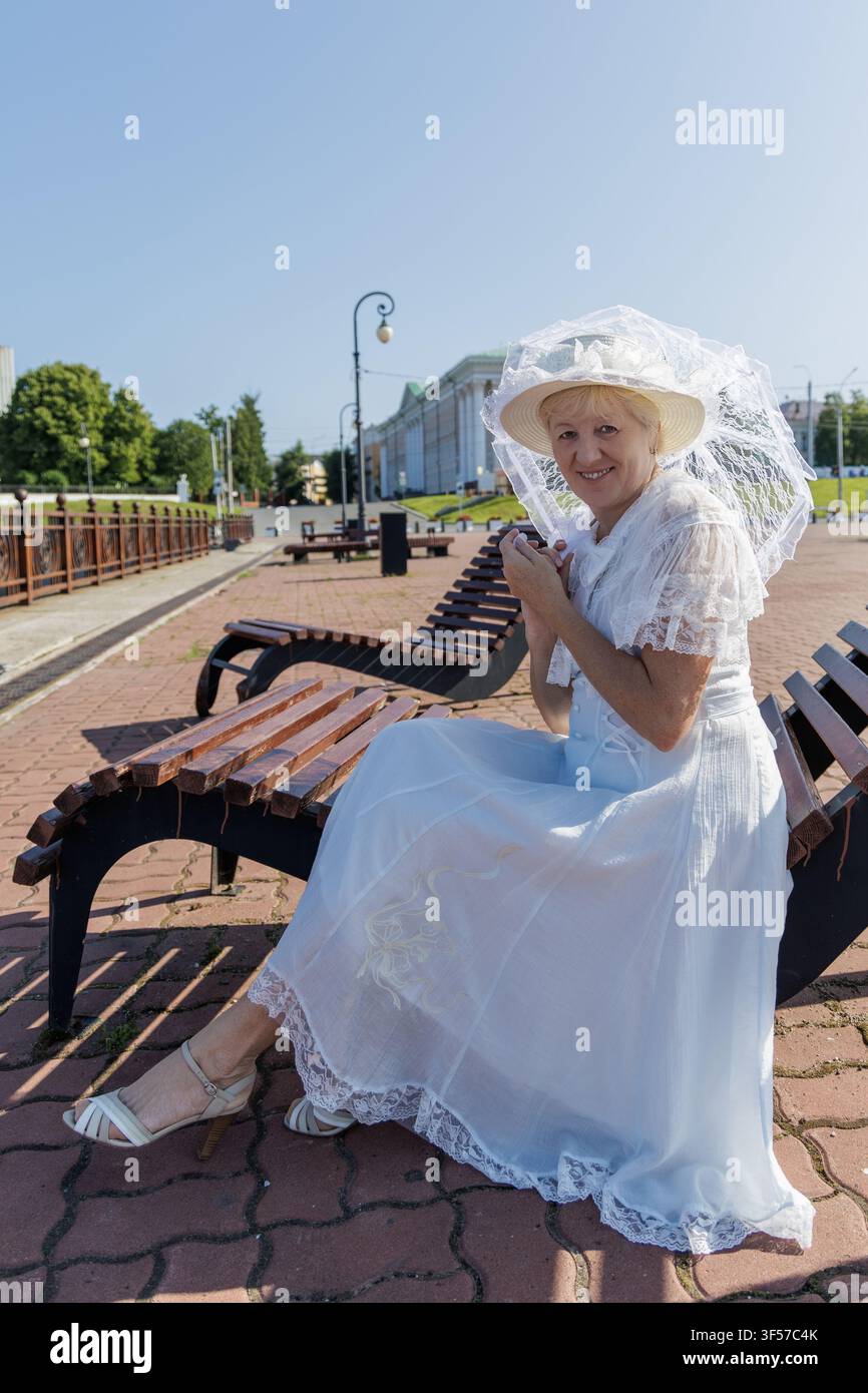 old lady white dress in vintage hi-res stock photography and images - Page 2 vintage white dress with sleeves