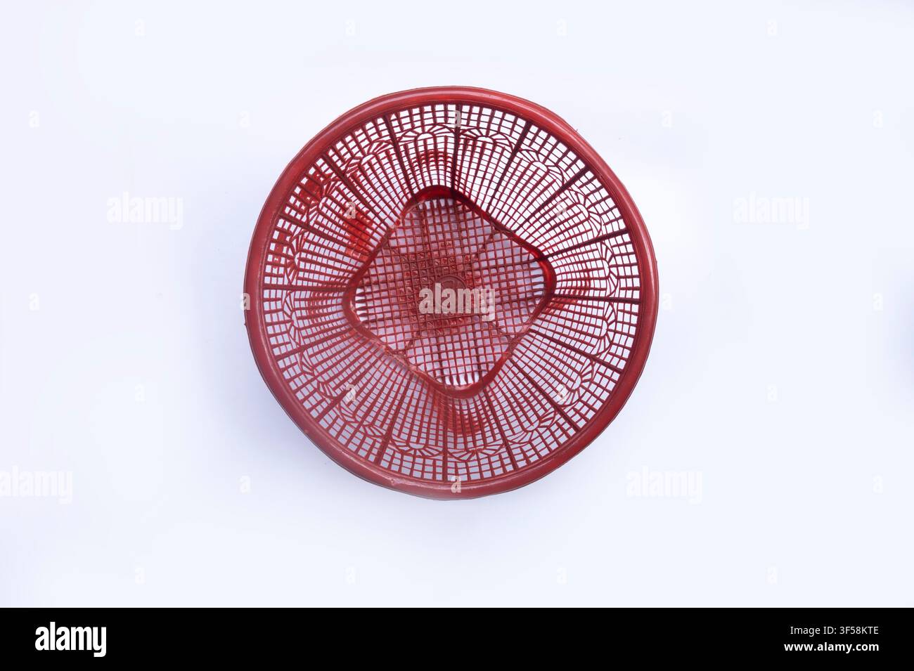 Empty Red Plastic Basket on White Background Stock Photo