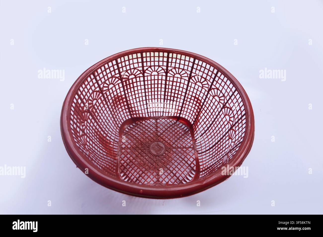 Empty Red Plastic Basket on White Background Stock Photo