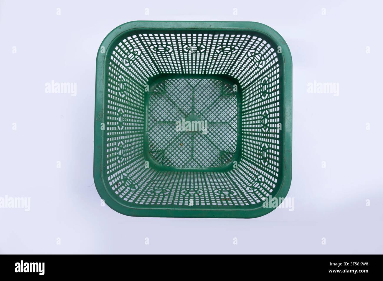Green Plastic Basket Isolated on White Background Stock Photo