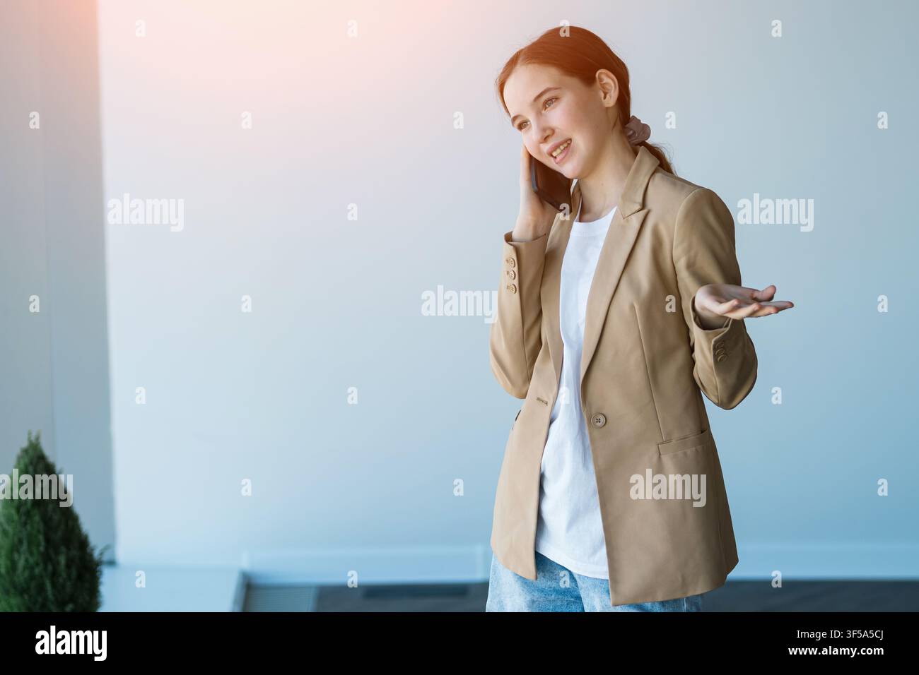 Young woman having professional phone call conversation Stock Photo