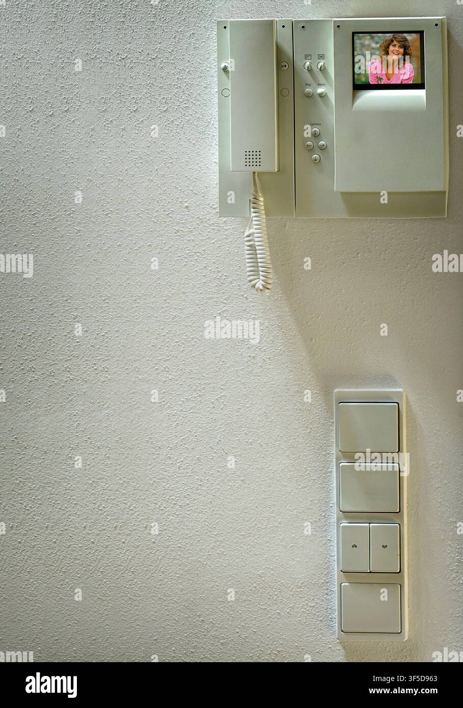 COMMUNICATION CONCEPT: Modern home security intercom unit and electrical switches Stock Photo