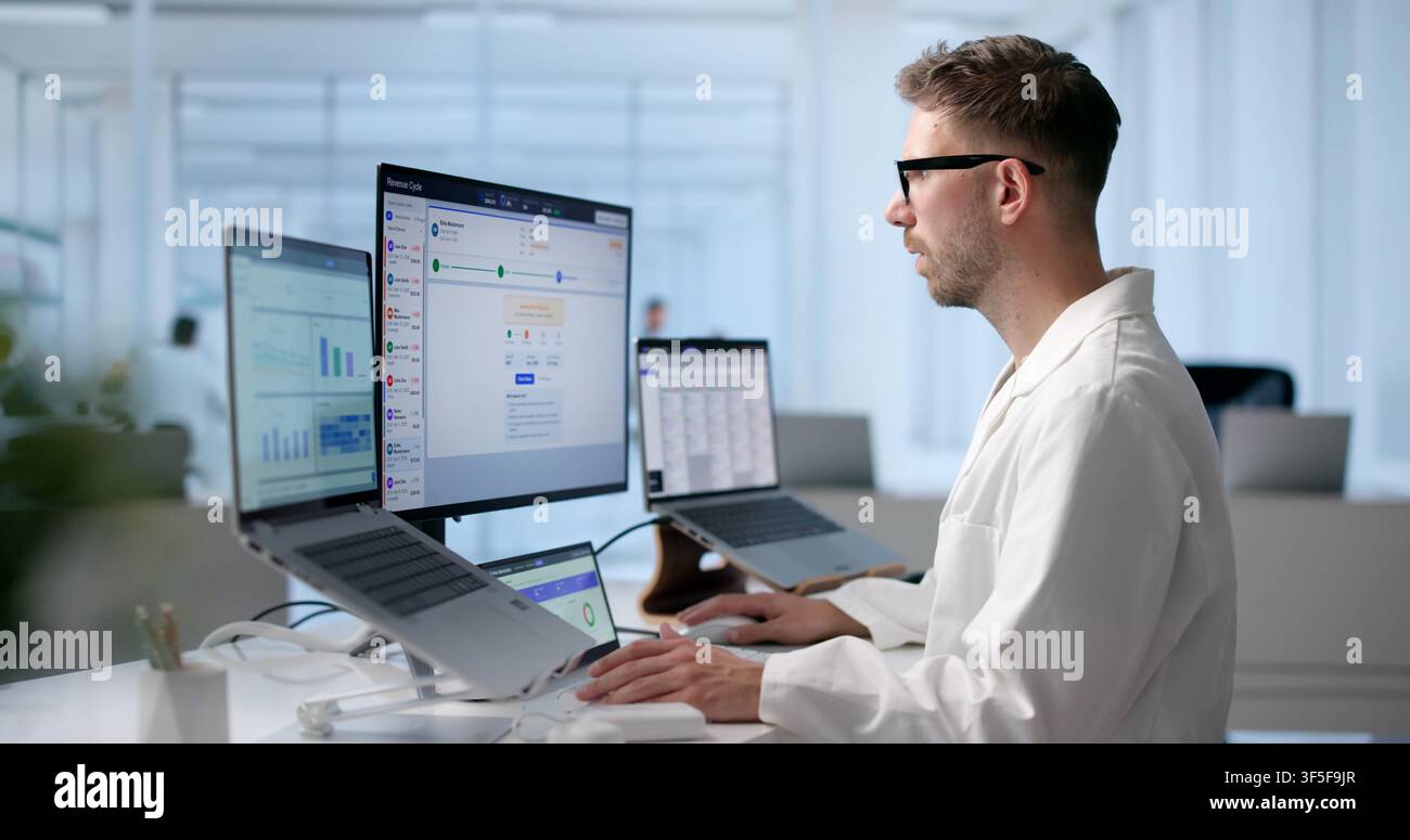 Man Reviews Patient Medical Claims On Laptop To Ensure Billing Accuracy. Stock Photo