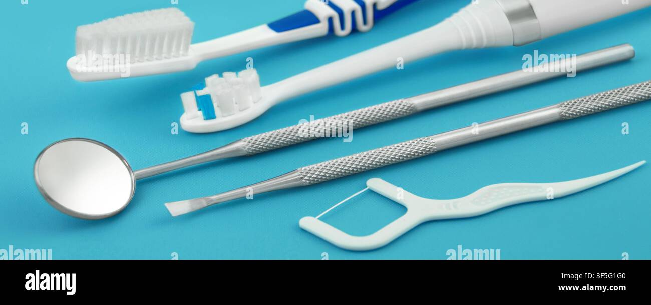 Dental care tools and products on blue background Stock Photo