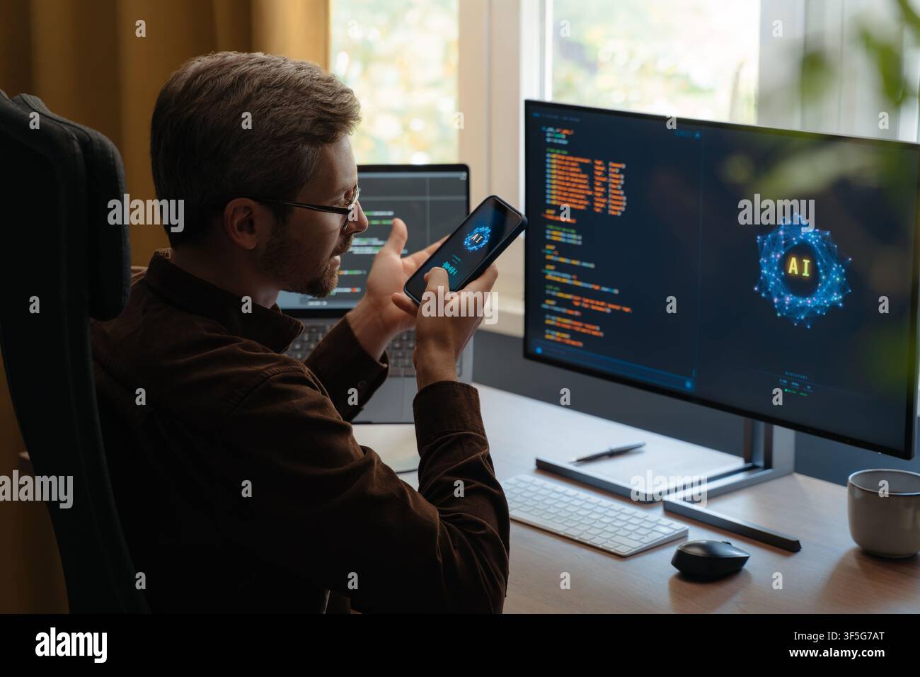 Programmer communicating with an AI agent through a smartphone, using a voice digital assistant on phone for software development and vibe coding. Man talking with Artificial intelligence powered app Stock Photo