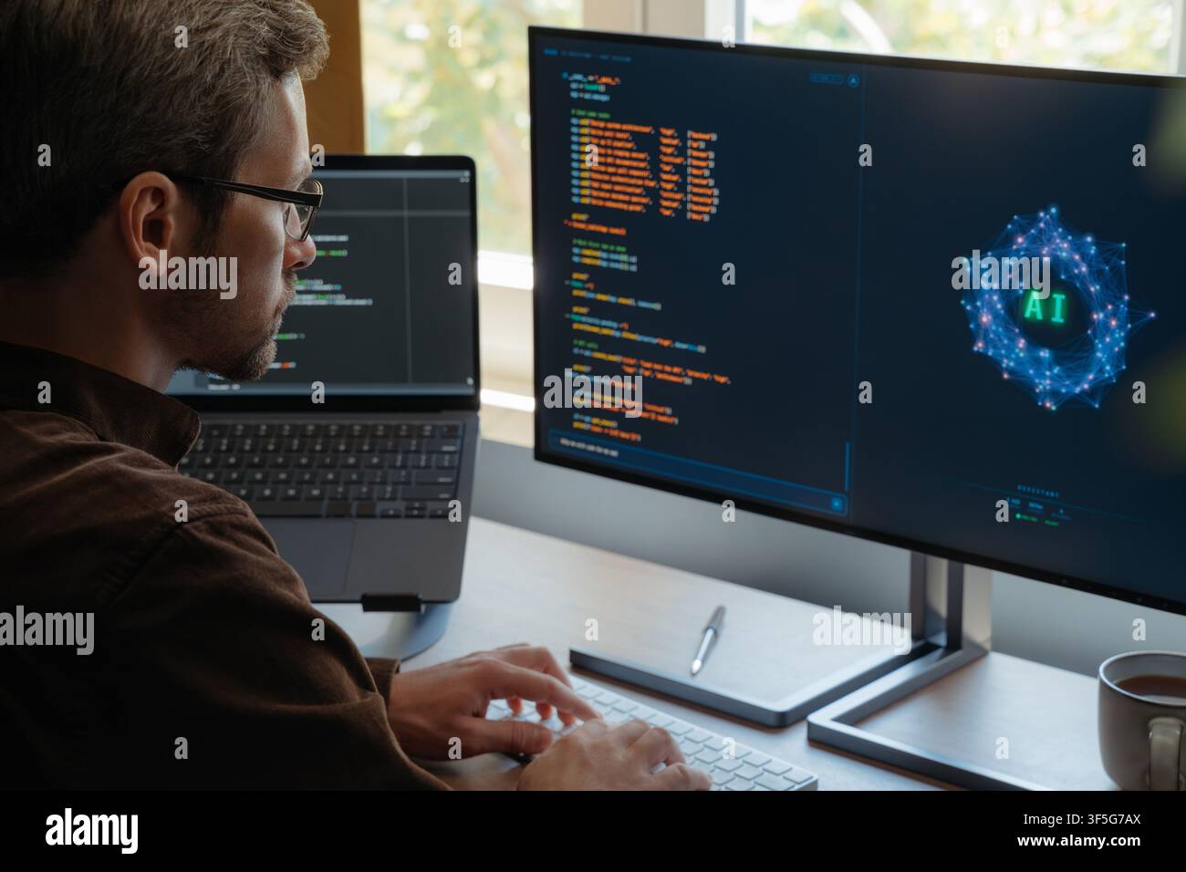 Focused coder using AI assistant to write programing code on computer at desk with dual screens, boosting productivity and automation with artificial intelligence agents and AI chatbots. Copy space Stock Photo