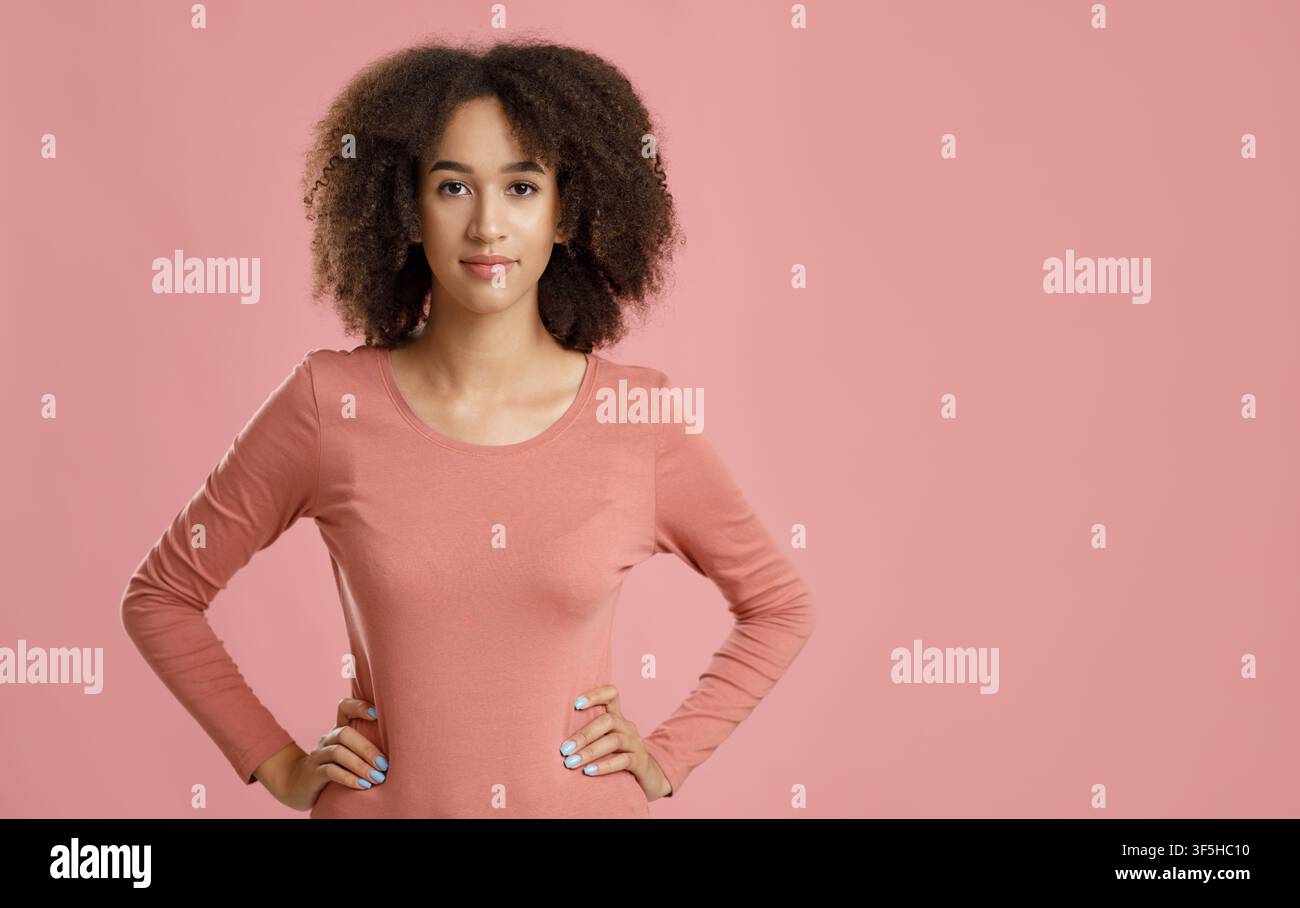 Serious facial expression, beautiful curly haired model Stock Photo