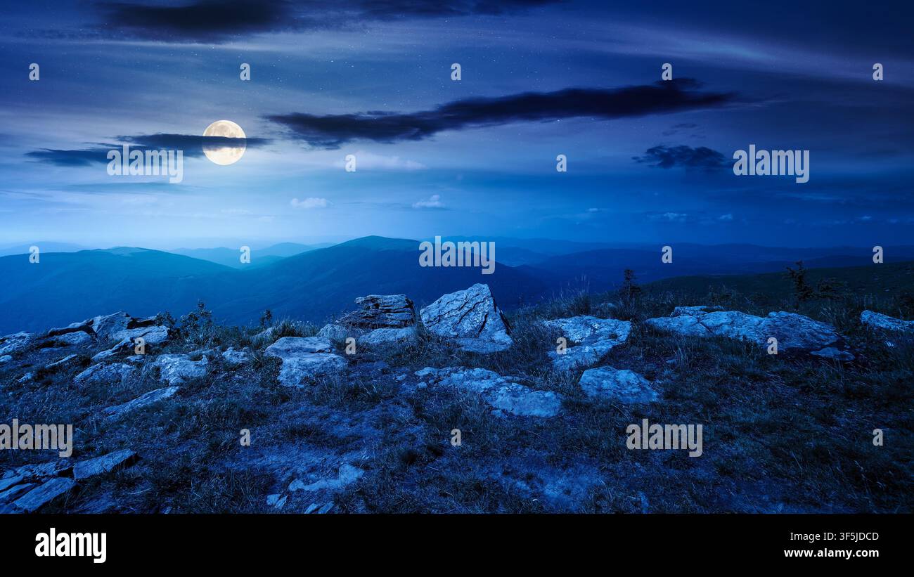 Carpathian mountain landscape in summer at night. scenic view of Transcarpathia region from the mnt. Smooth. alpine blueberry field with rock on the P Stock Photo