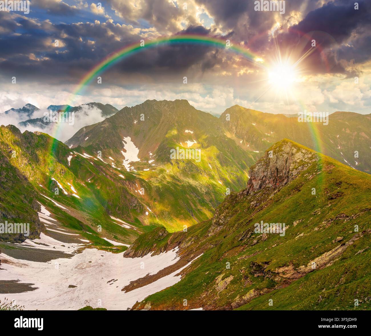 sunset over romania mountain landscape in summer. travel background of alpine scenery in fagaras mountain ridge in evening light. european summer outd Stock Photo