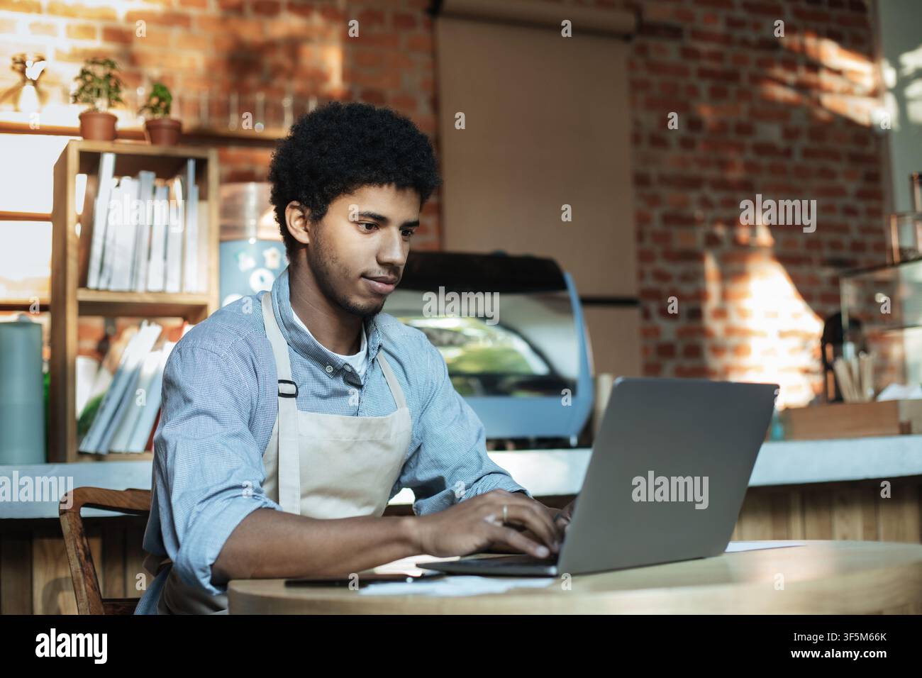 Man owner working and checking email on computer Stock Photo