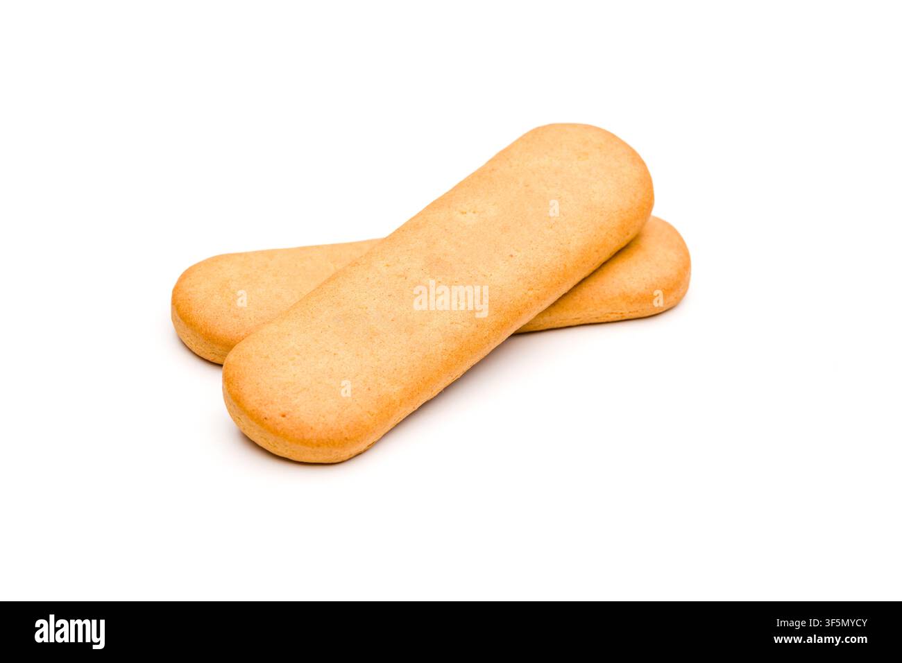 Three plain golden biscuits isolated on a clean white background Stock Photo