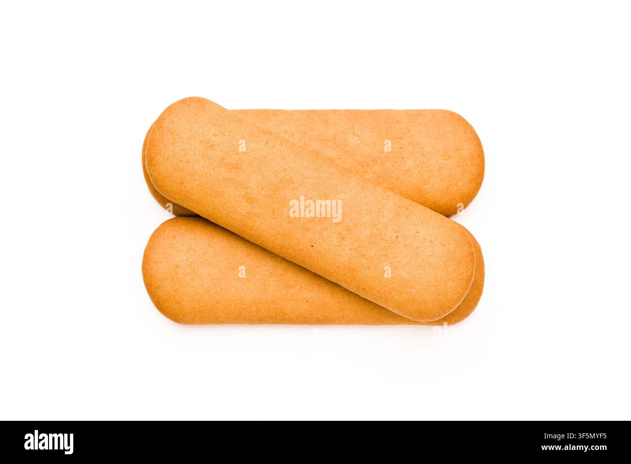 Three overlapping golden biscuits isolated on a white studio background Stock Photo