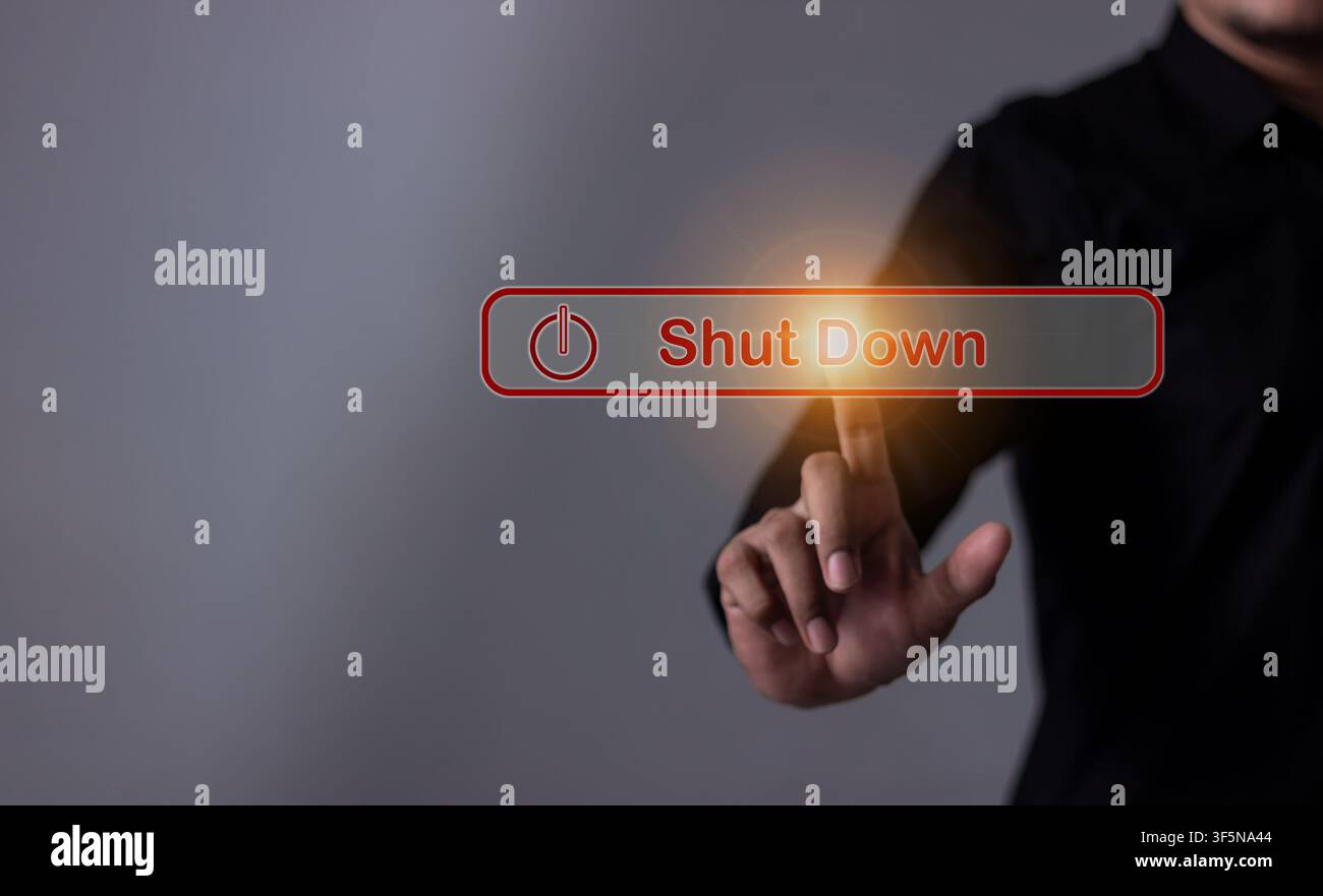 Young man hand touching Shut Down button press power OFF Stock Photo