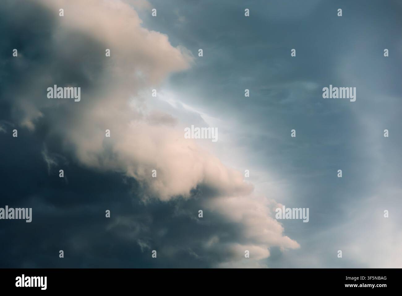 Dramatic storm clouds fill a moody sky Stock Photo