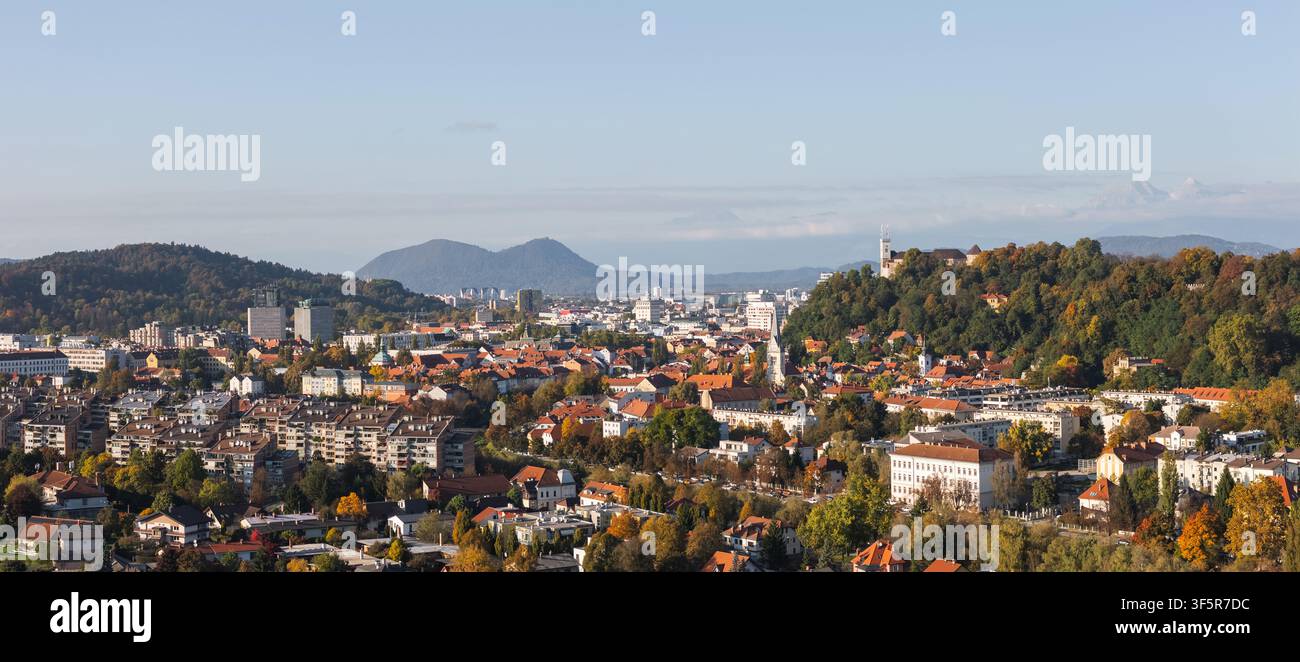 Ljubljana panorama, the capital city of Slovenia. The view highlights buildings, hills, and a clear sky in the background. Stock Photo