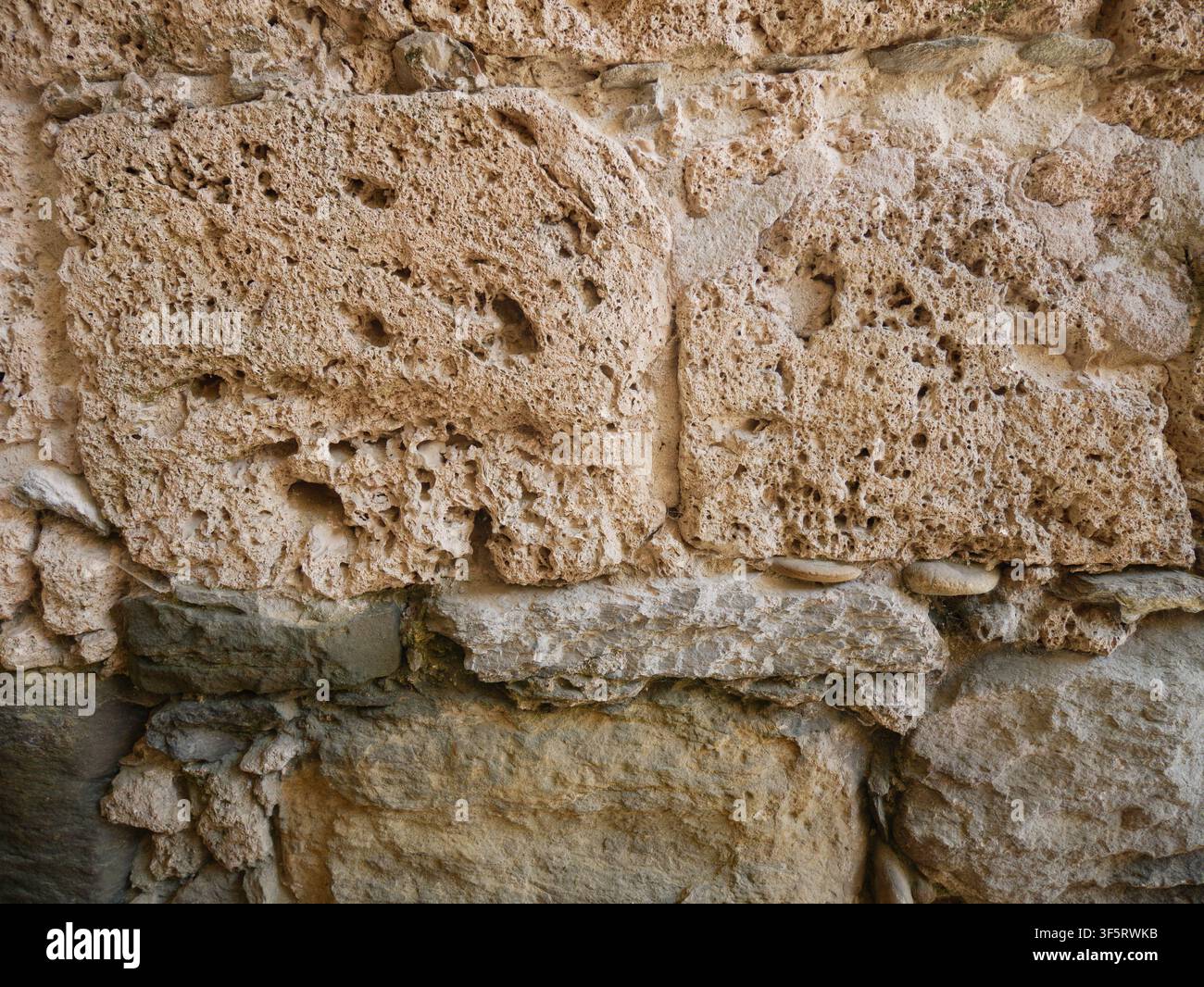 Rough Natural Stone Wall Texture with Large Irregular Blocks Stock Photo