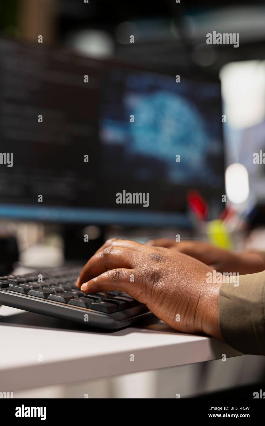 Close up of admin typing on PC keyboard, adjusting machine learning algorithms parameters at work to automate tasks. Tech startup worker writing AI code, doing optimizations Stock Photo