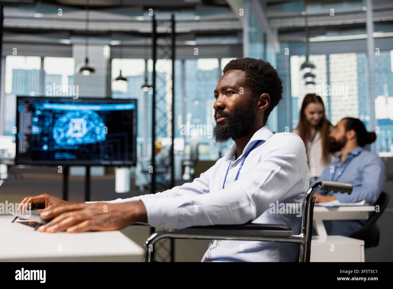 Software developer in wheelchair using AI automation, refining algorithms for faster processing. African american programmer with paraplegia using artificial intelligence for resource optimization Stock Photo