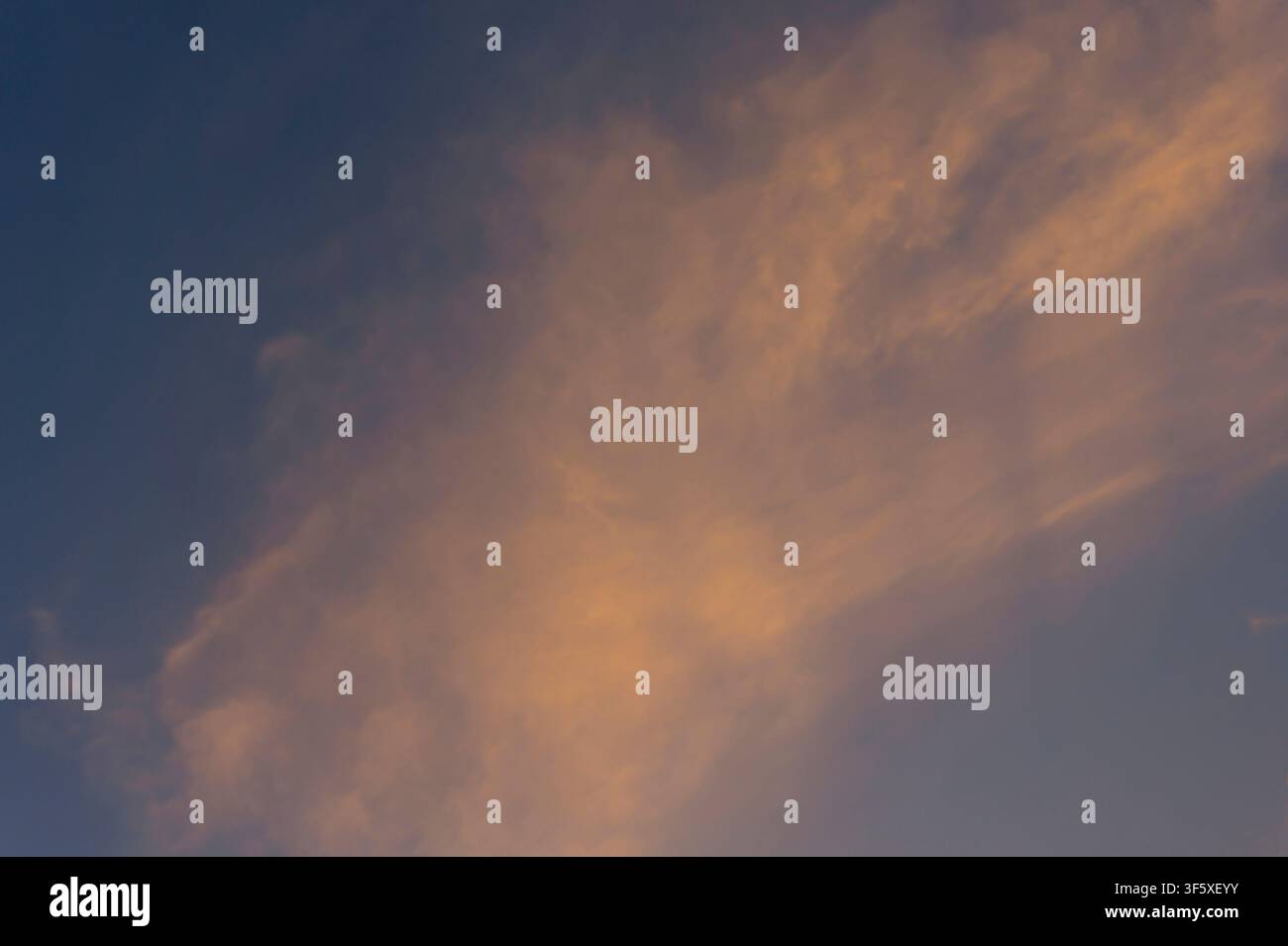 Soft Orange Sunset Clouds in Evening Sky Stock Photo