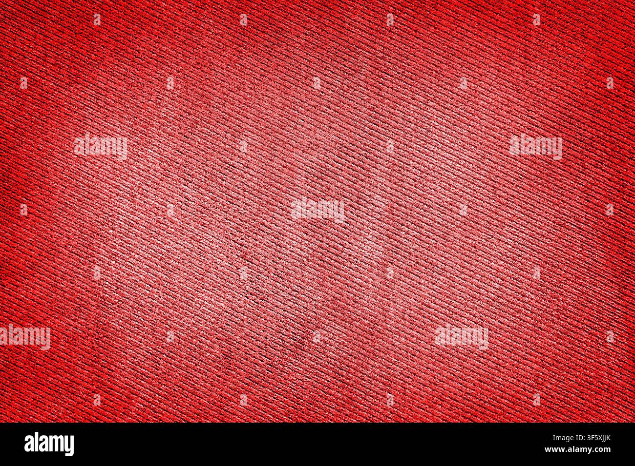 Red fabric woven texture macro background high contrasted with vignetting effect Stock Photo