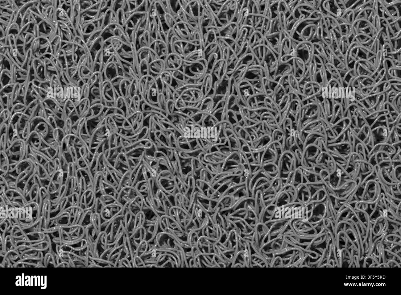 Gray background wavy fibers plastic string material texture black and white. Stock Photo