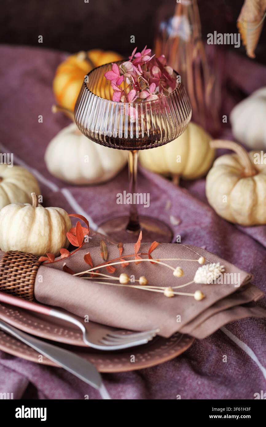 Elegant autumn table setting with pumpkins and vintage glass Stock Photo