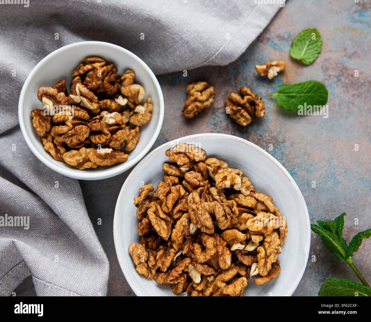Walnuts without shell on a concrete background Stock Photo