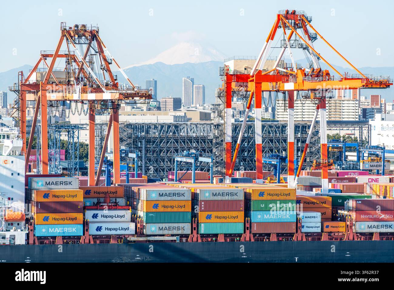 Tokyo Japan , 24 January 2026 : Tokyo port scenic view with container ship and containers with two cranes and mount Fuji in Tokyo Japan Stock Photo