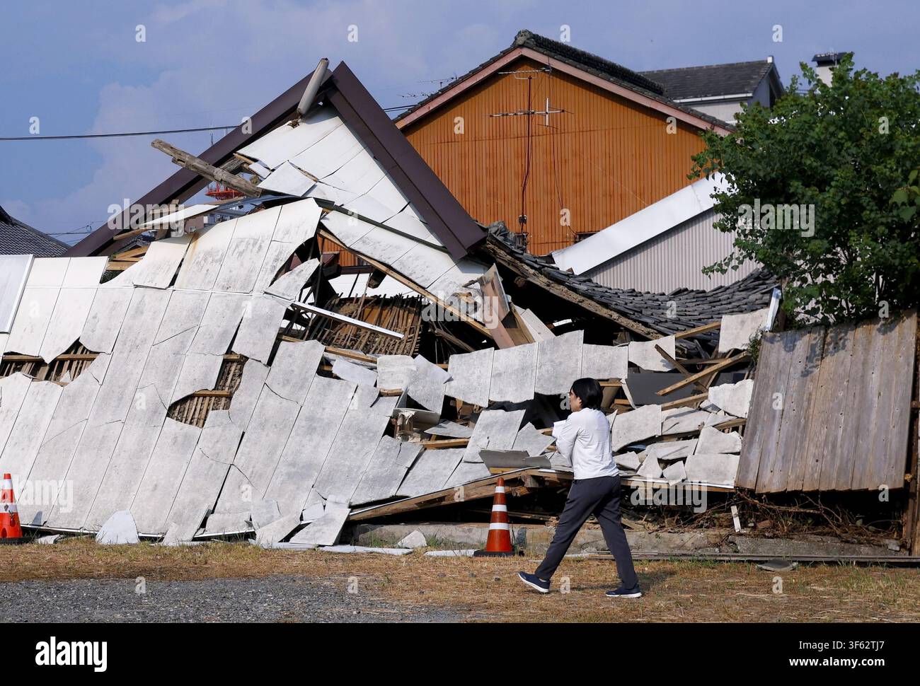 Collapsed houses are pictured in Yatsushiro, Kumamoto Prefecture, on ...