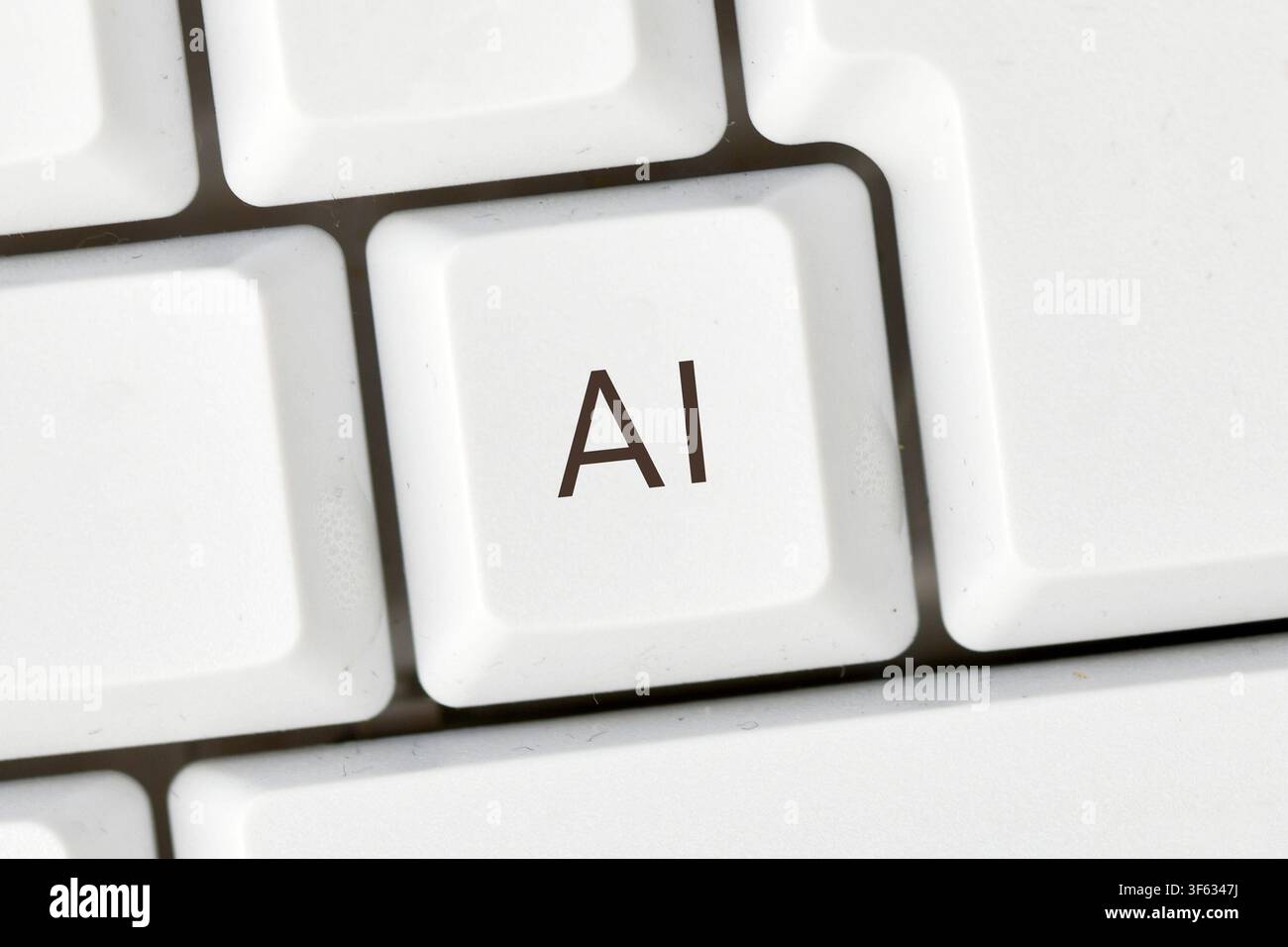 Keyboard key with AI text symbolizing artificial intelligence and digital technology Stock Photo