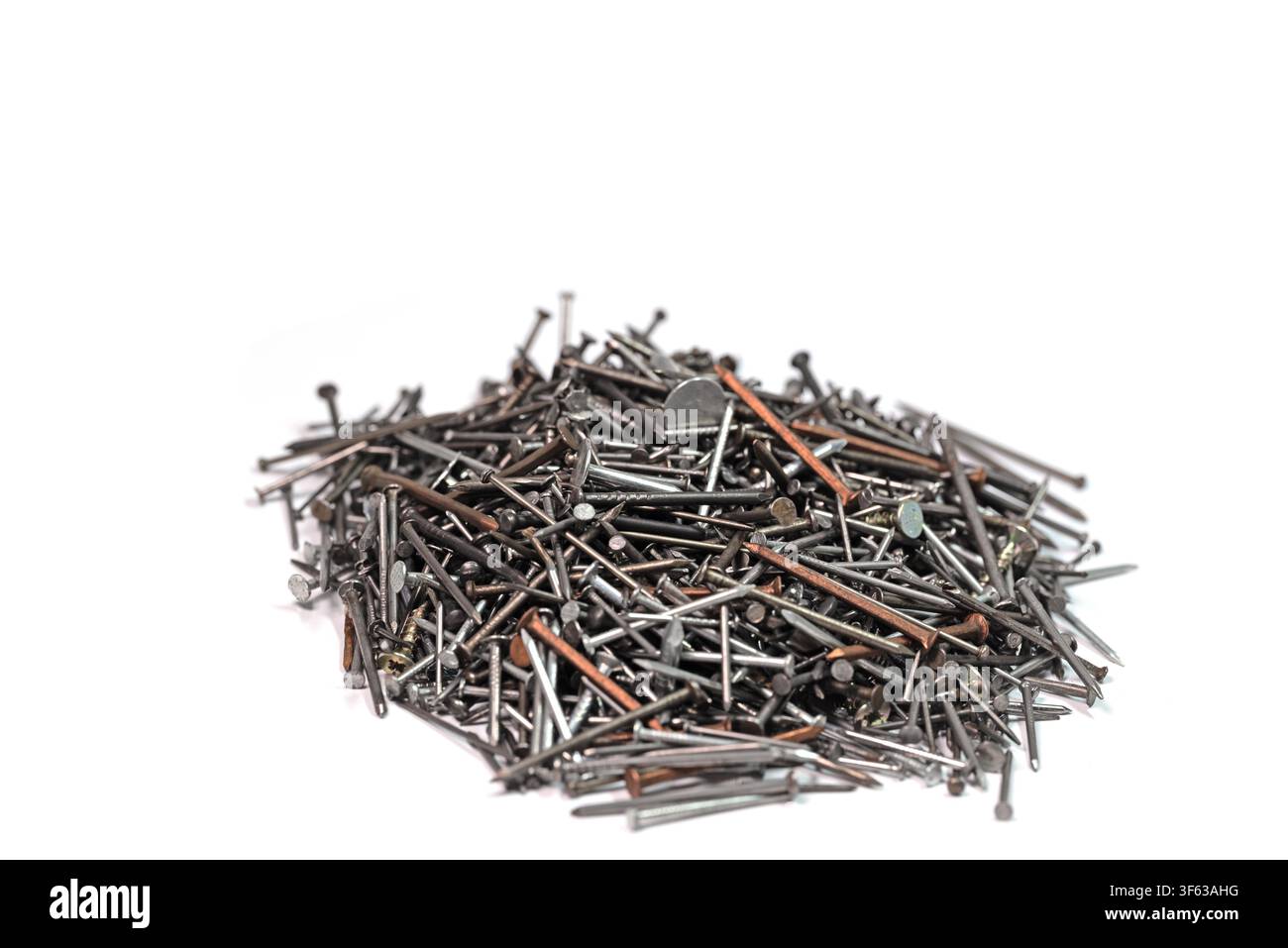 Many different nails against a white background Stock Photo