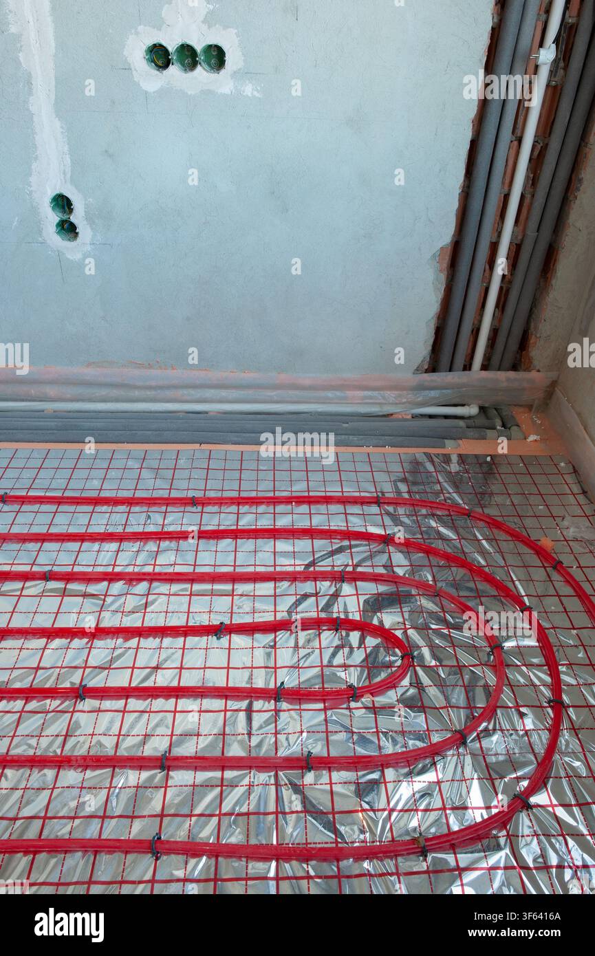 Underfloor surface heating pipes. Low temperature heating concept Stock Photo