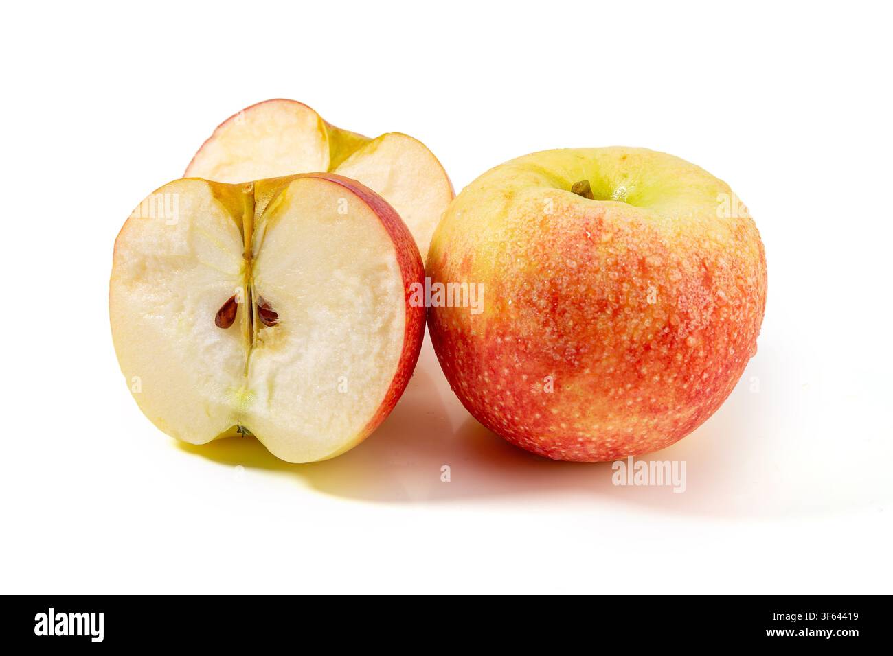 Whole and Half Cut Red Gala Apple Stock Photo