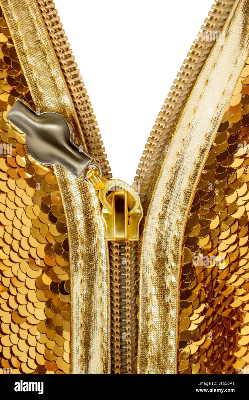 Unzipped golden sequins fabric closeup on white as a background Stock Photo