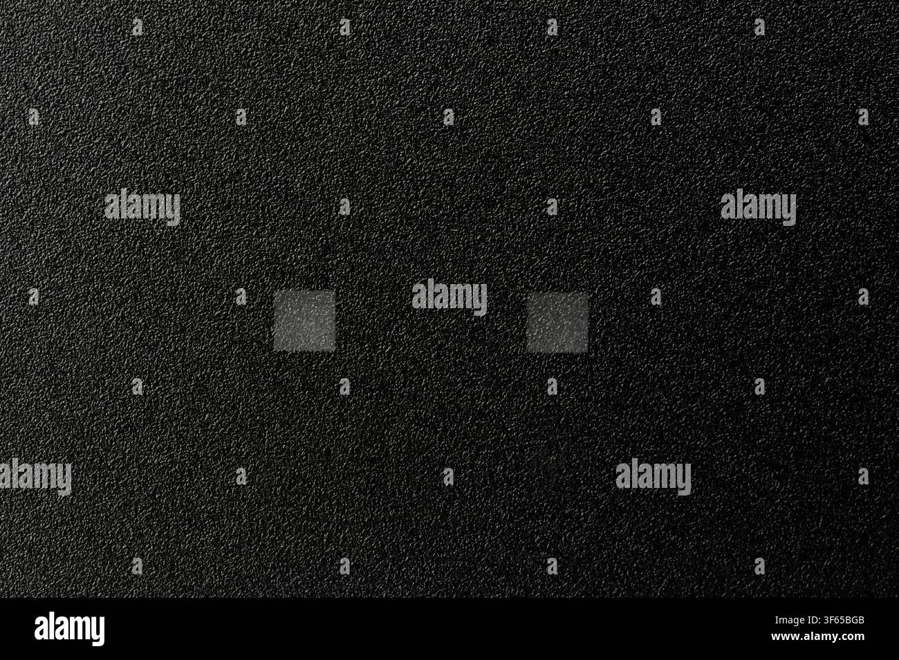 Black plastic matte surface with light indicator squares macro close up view Stock Photo