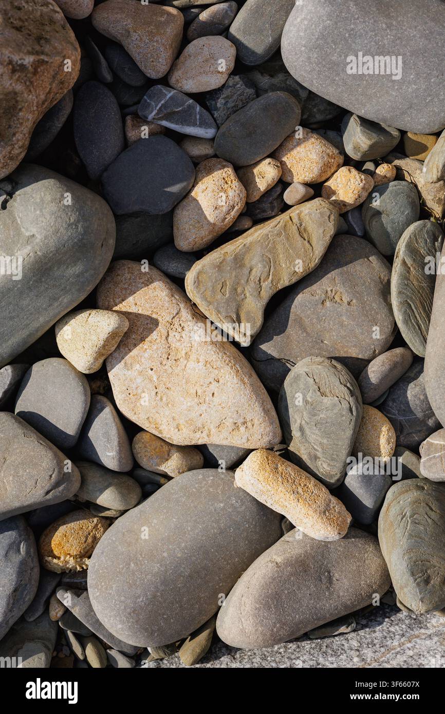 Rounded Beach Stones Background With Natural Coastal Texture Stock Photo