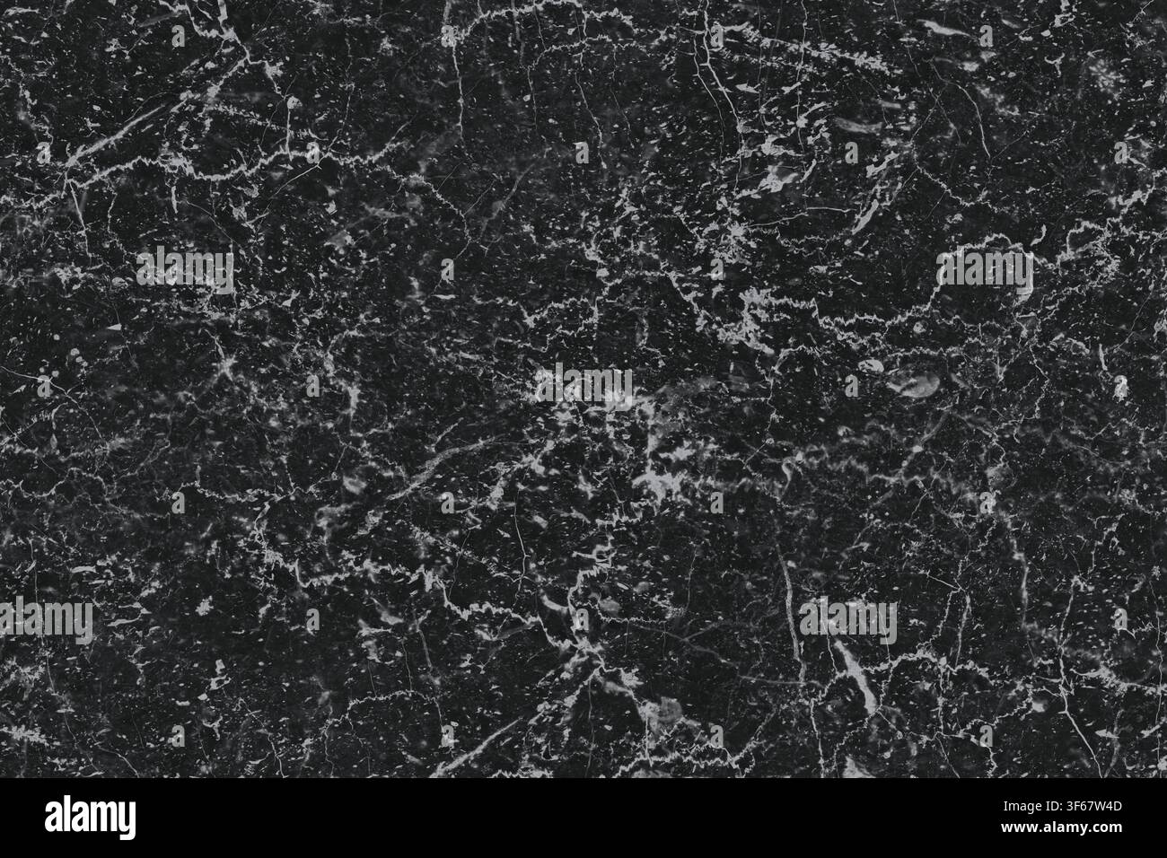 High resolution texture of black marble featuring fine white linear veins. Stock Photo