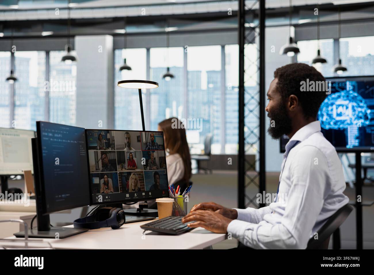 Tech company office team collaborating via videocall, doing brainstorming on backup solutions to protect against data loss. Remote workers doing AI coding during online teleconference Stock Photo