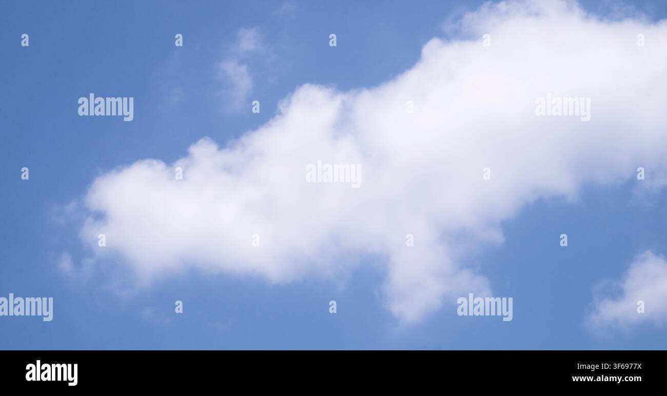 Single White Cloud In Blue Sky Nature Background Stock Photo