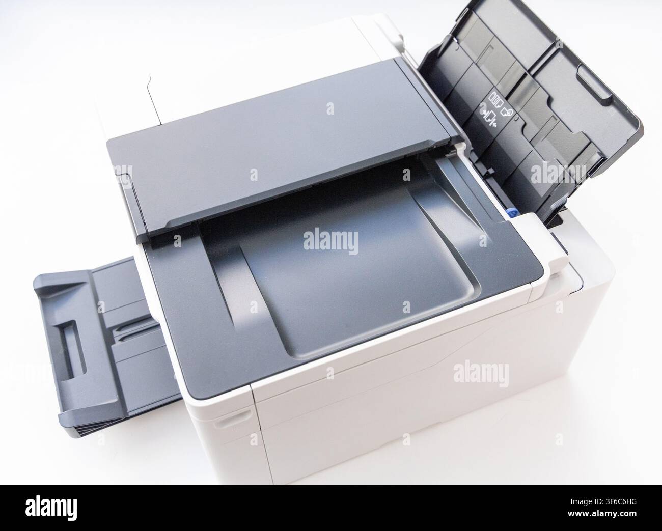 A modern office laser printer is isolated on a clean white background Stock Photo