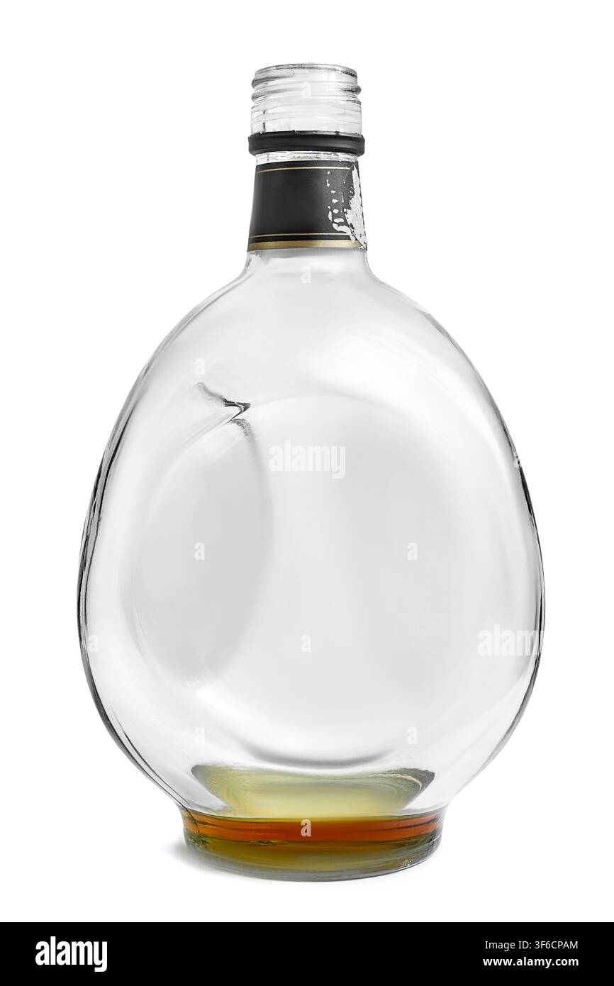 Empty brandy glass bottle standing on white background Stock Photo