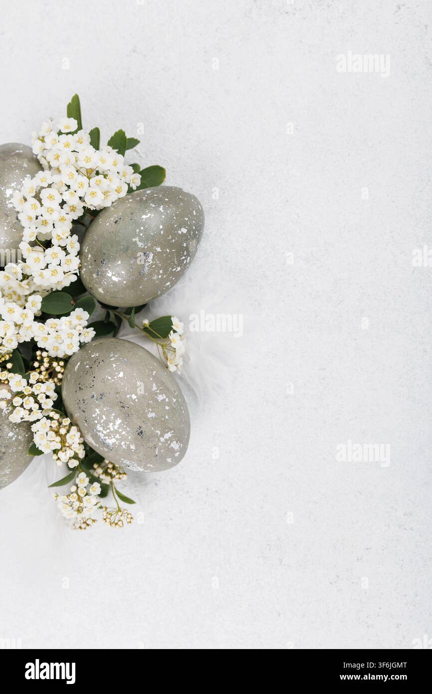 Speckled easter eggs floral border minimal composition Stock Photo