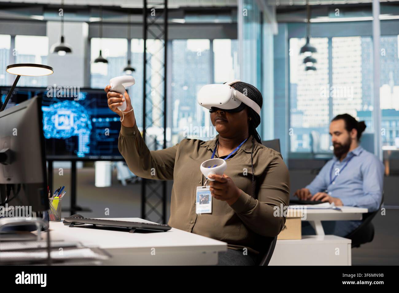 Software developer using virtual reality tech, automating repetitive tasks with AI scripts. IT expert wearing VR gear using artificial intelligence to speed up feature implementation Stock Photo