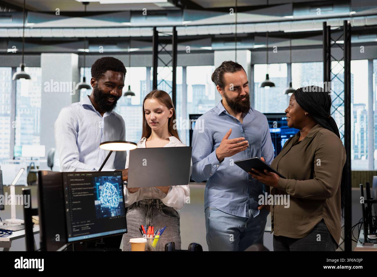Team of programmers in office using AI automation scripts to reduce repetitive coding tasks in tech office. Teamworking IT specialists using artificial intelligence technology in startup workspace Stock Photo