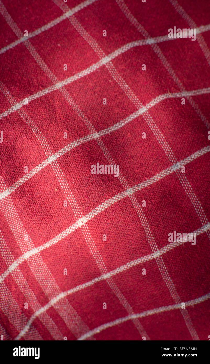 Red Checkered Fabric Texture Background With Diagonal Folds Stock Photo