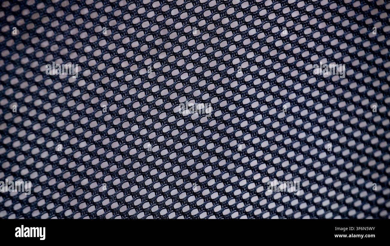 Black Perforated Mesh Texture Background Close Up Stock Photo