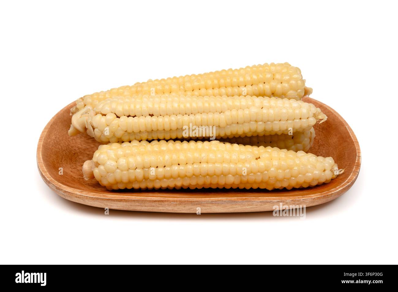 Steamed sweet corn cobs on a wooden tray Stock Photo