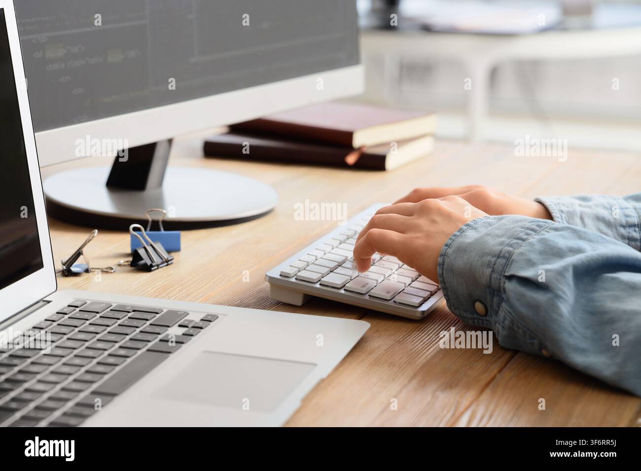 Female programmers hands testing code on computer in office, closeup Stock Photo